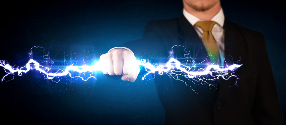 Business man holding electricity light bolt in his hands concept